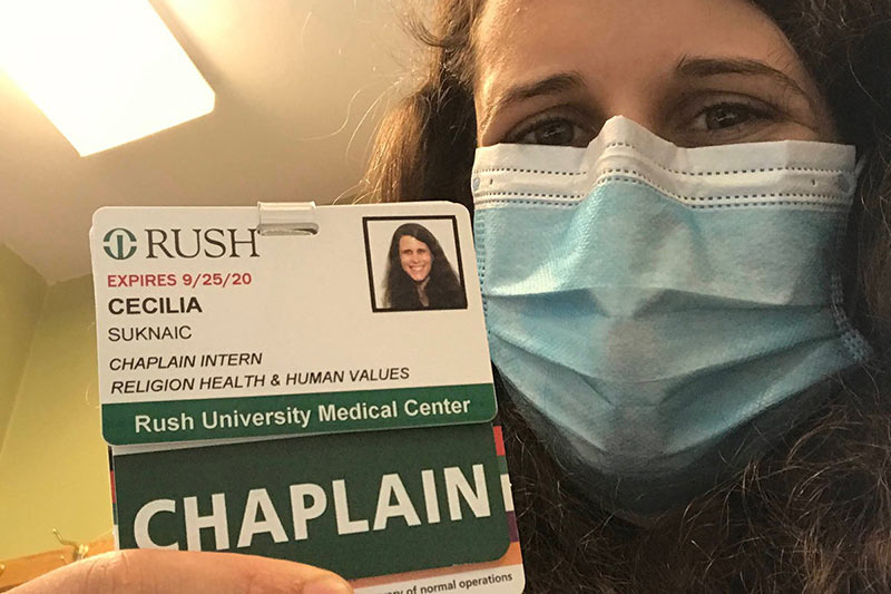 Cecie Suknaic Saulnier holding her Rush University Medical Center Chaplain card