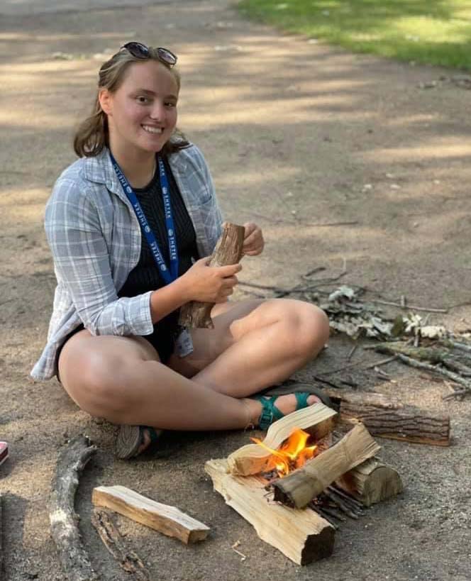 Incoming MDiv student Leah Berdahl making a fire