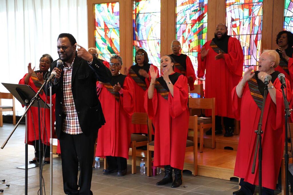 A lead singer belts along with the choir in LSTC's chapel