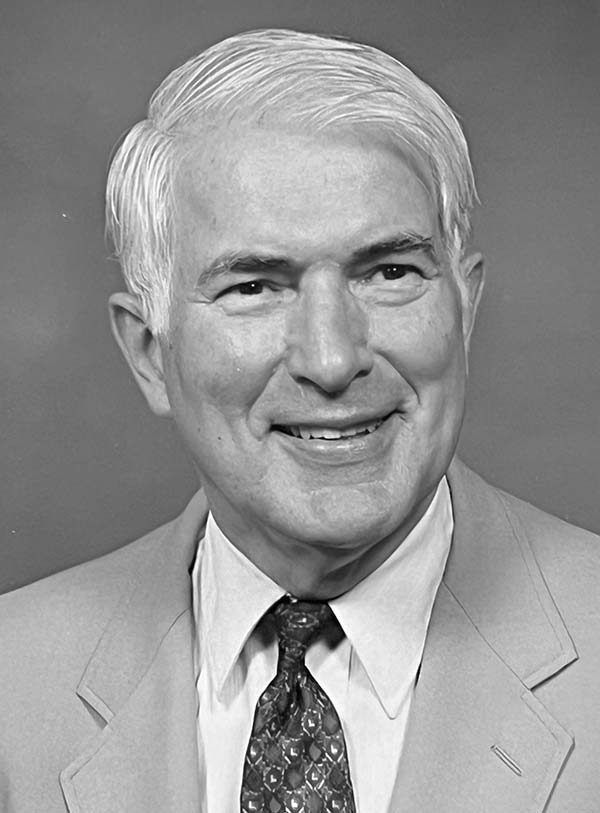 A black and white headshot of Dr. James A. Scherer