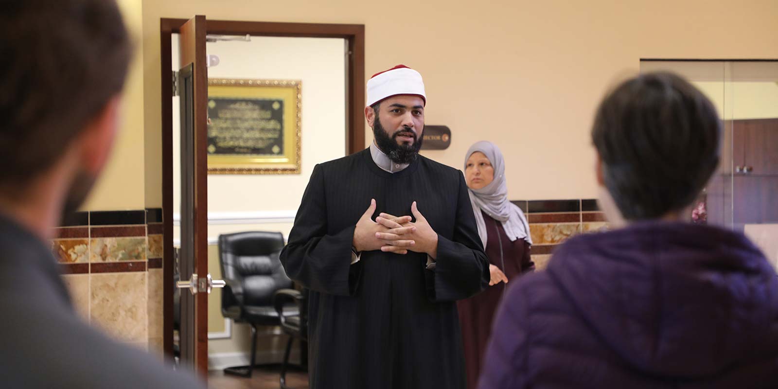 Hassan Aly speaking at The Mecca Center during the Interfaith Trolly Tour.