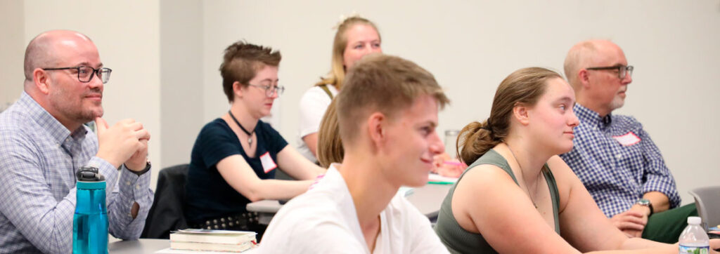 LSTC students, faculty, and staff in a lecture during orientation.