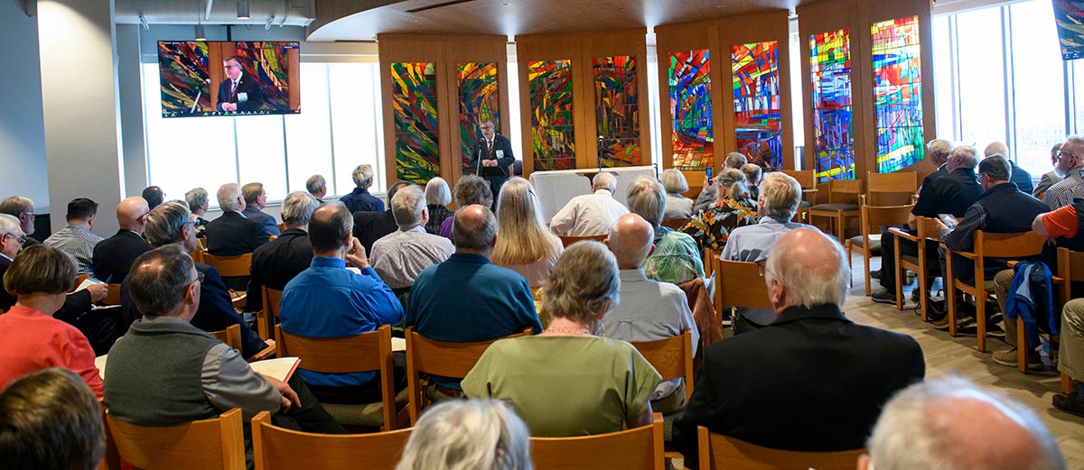 LSTC President James Nieman speaking to a crowd in the LSTC Chapel.