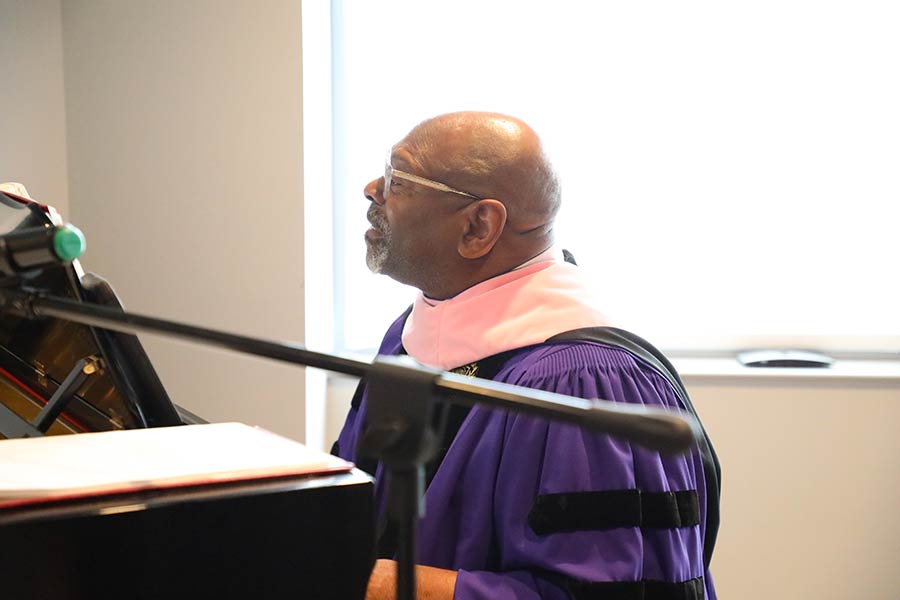 Keith "Doc" Hampton, Cantor to the Community, plays piano in the LSTC Chapel.