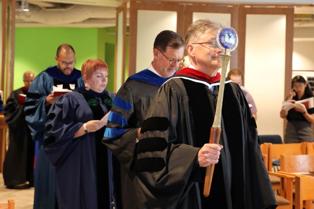 Opening procession into the LSTC Chapel during the service of Holy Communion and Convocation, led by Mark Swanson.