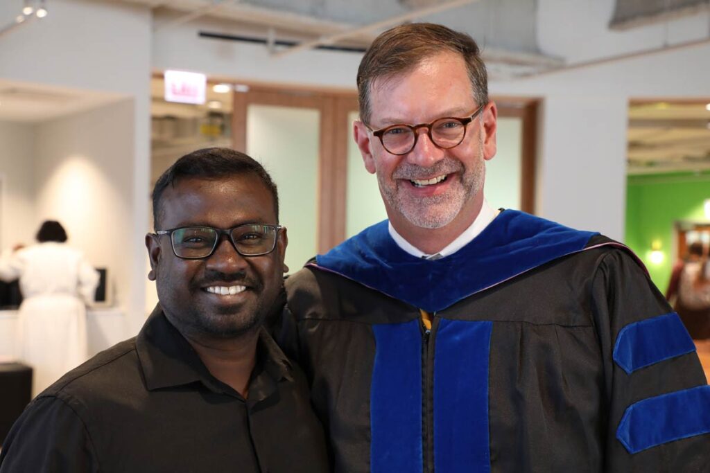 Rev. Erik Christensen and Immanuel P. Karunakaran smiling in the LSTC Chapel.