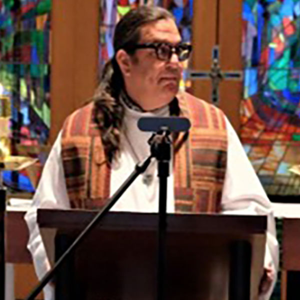 Headshot of Pastor Manuel Retamoza.