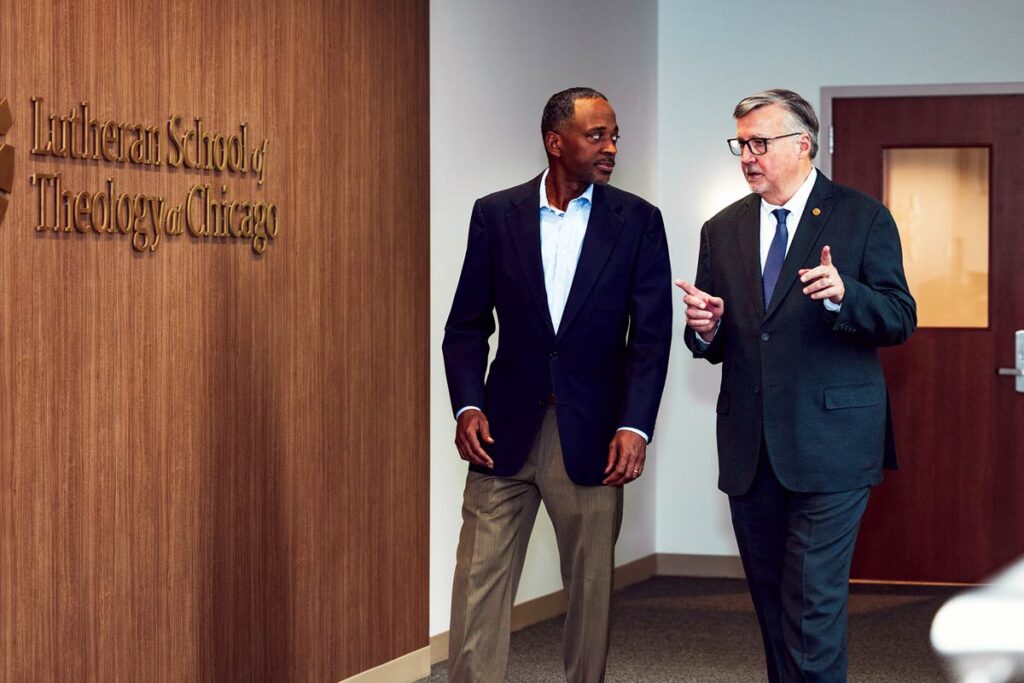 President James Nieman walks with Vice President for Finance and Operations Richard Vivian.