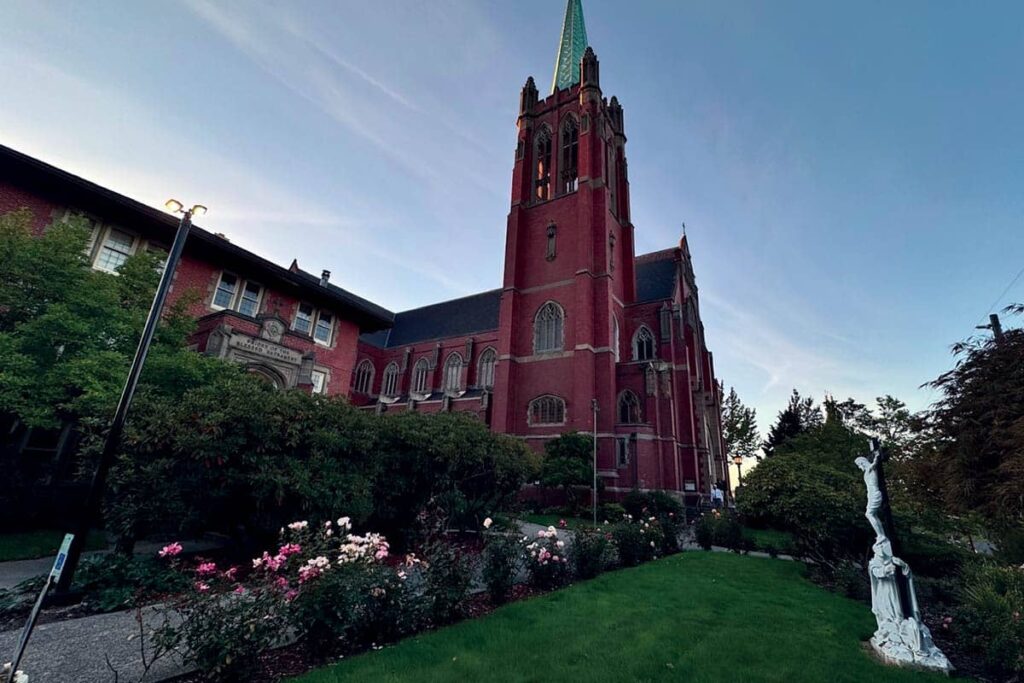 A red brick Blessed Sacrament Catholic Church in Seattle.