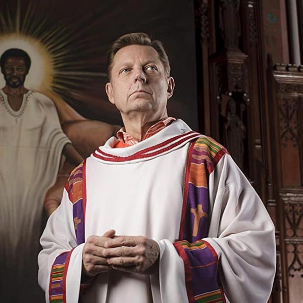 Headshot of Michael Pfleger wearing his vestments.