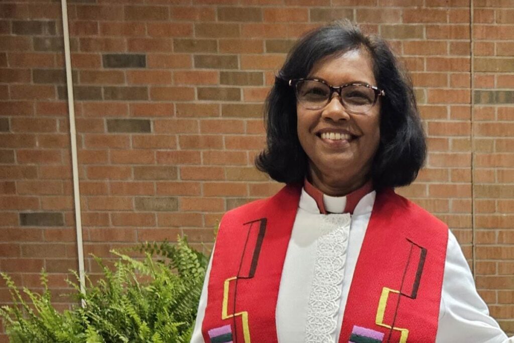 Rev. Dr. Margaret MacDonald smiling in her vestments.