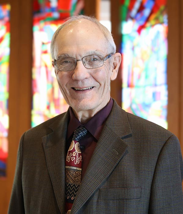 Interim President Michael Cooper-White smiling in the LSTC Chapel.