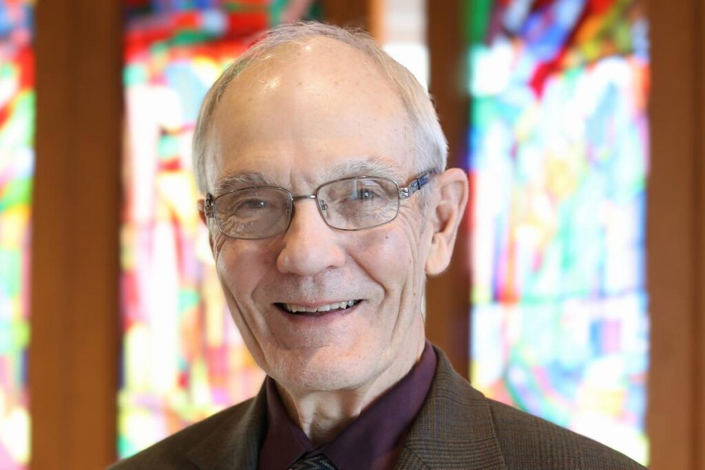 Interim President Michael Cooper-White smiling in the LSTC Chapel.