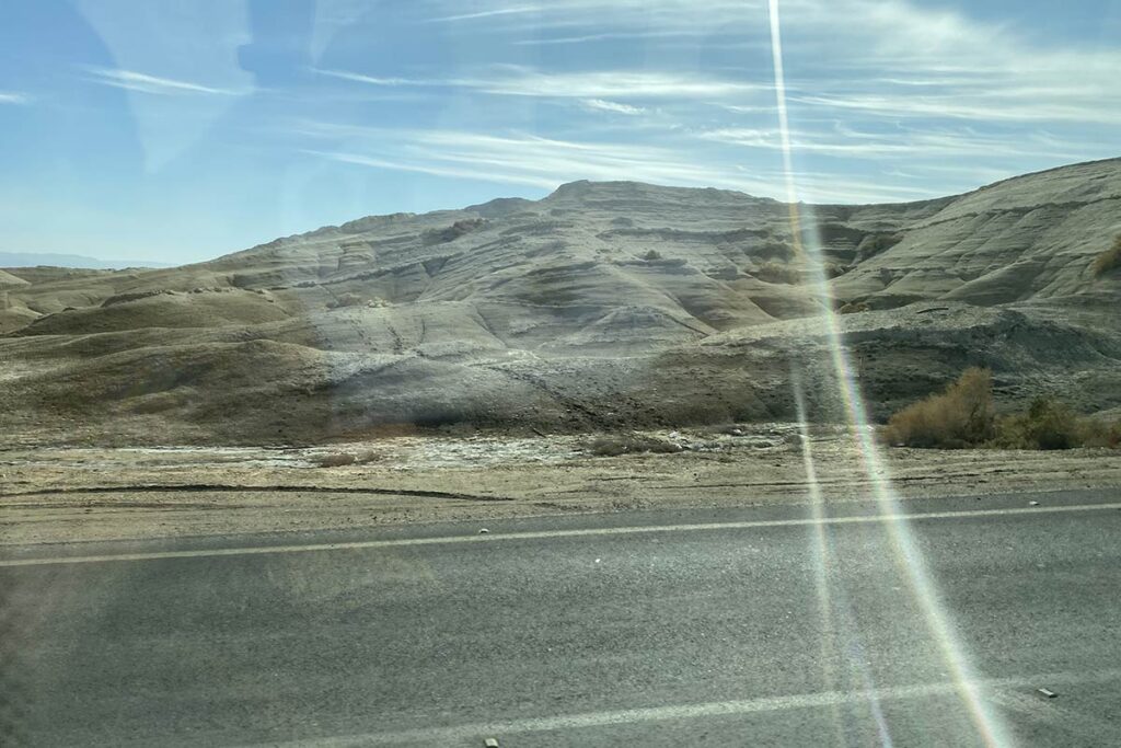 A hilly countryside with a lens flare in Palestine/Israel.