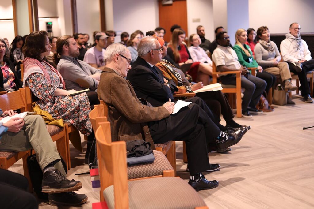 Interim President Michael Cooper-White taking notes during service in the LSTC Chapel.