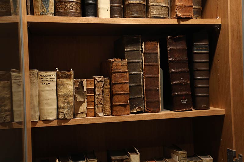 Old books on the shelf in LSTC's Rare Books Room.