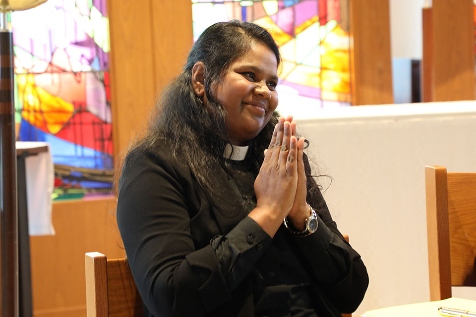 An LSTC student's hands in prayer.