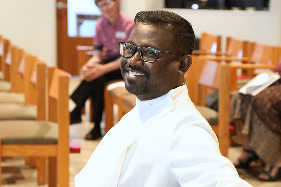 An LSTC student smiling in the chapel.