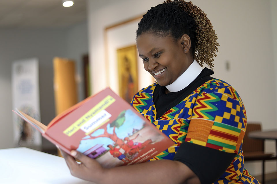 A PhD student lost in a book.