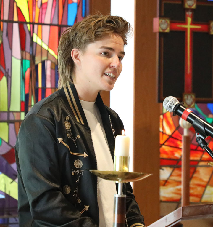 A student reading during worship in the LSTC Chapel.