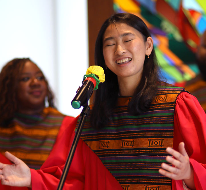 An LSTC choir singer belting into the microphone.