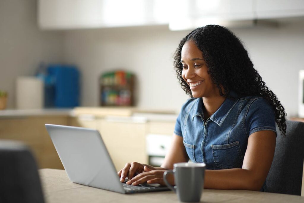 An Project Starling student working on her laptop.