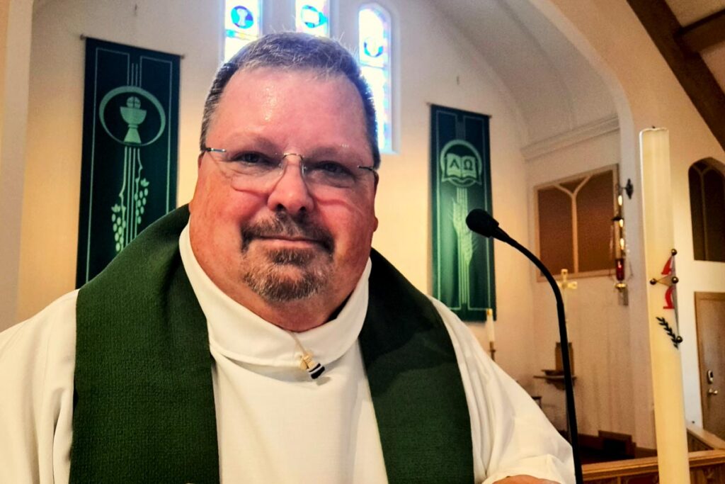 Jim Krauser at the podium in his congregation.