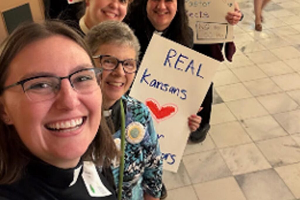 Noni Strand demonstrating with a group of women at a protest.