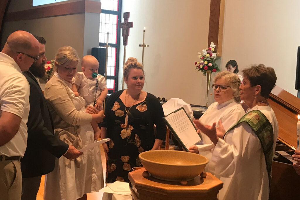 Pat Gerber conducting a baptism.