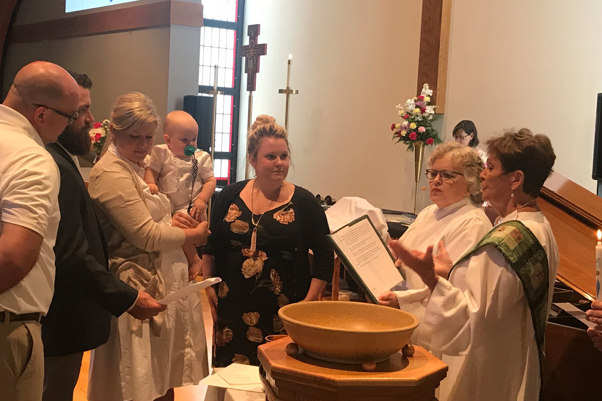 Pat Gerber conducting a baptism.