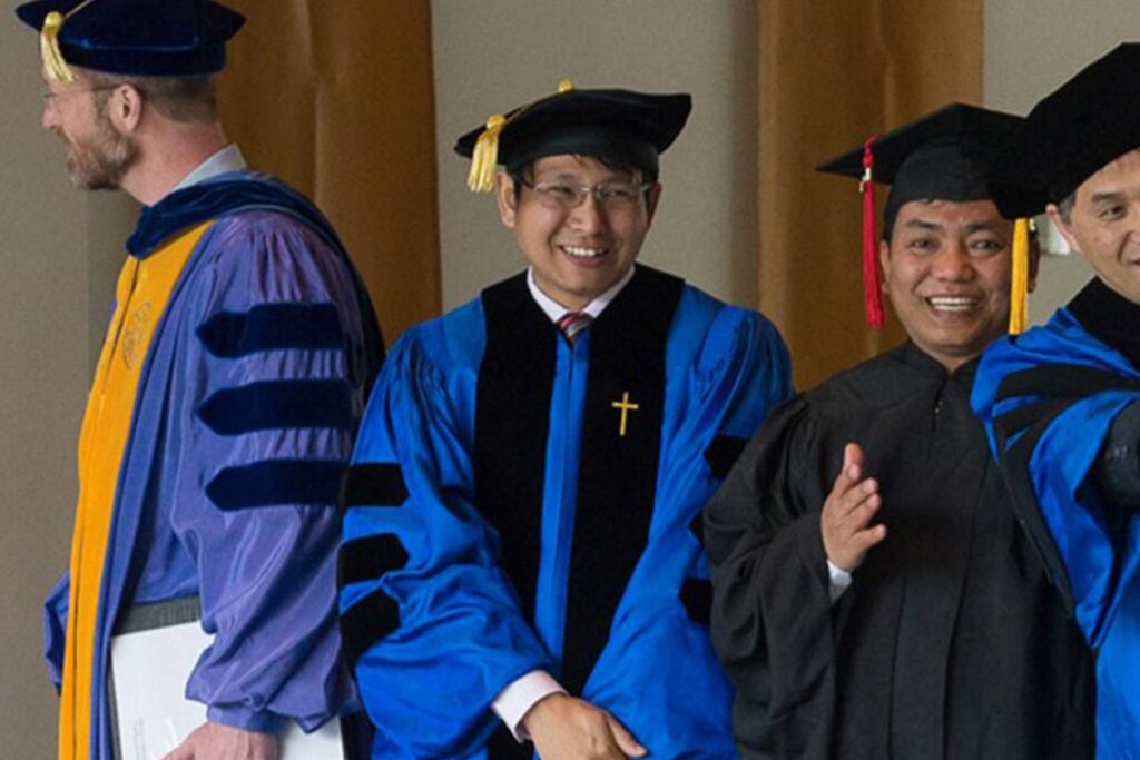 Saw Solomon Opehtoo at graduation in his cap and gown.