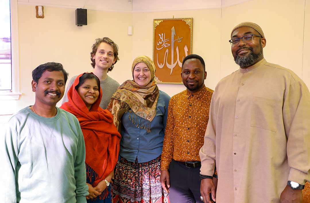 Chicago Interfaith Trolley Tour attendees pose at one of the stops.