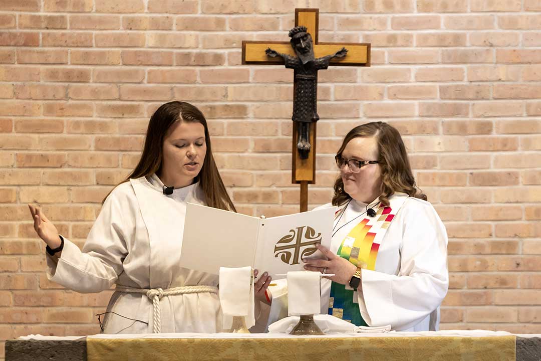 An LSTC student and instructor leading worship.